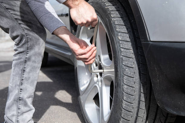 istock changes the wheel of the car 1361401432
