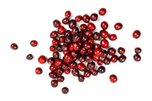 fresh red cranberries isolated on white background