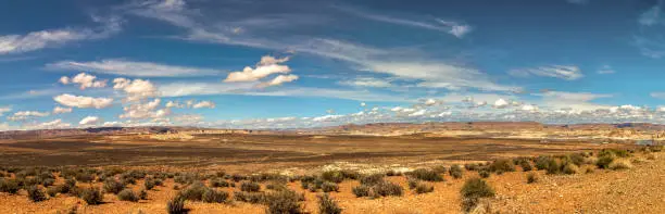 Photo of Panoramic view of the distant hills and beautiful cloudscape on the desert, Wahweap lookout, Page, AZ