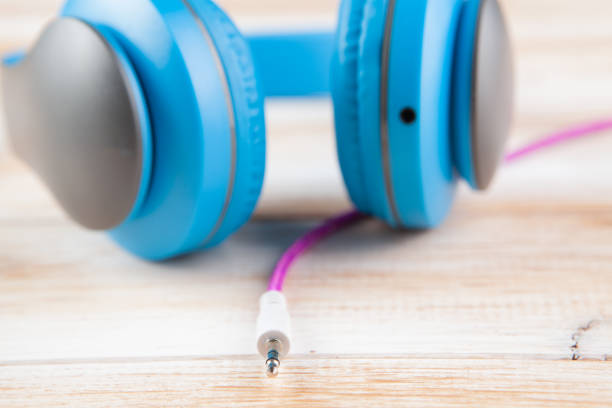 Close up photo of white headphones on a white background.