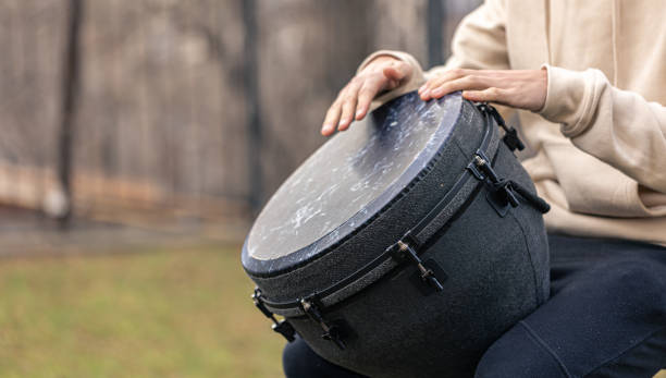 istock A man plays the djembe drum outside. 1361406661