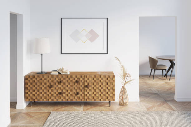 White hallway with a horizontal poster above a wooden dresser between two doorways, dried flowers in an openwork vase, a carpet on a parquet floor, a table, and a chair in the background. 3d render dresser domestic room entrance hall home interior stock pictures, royalty-free photos & images