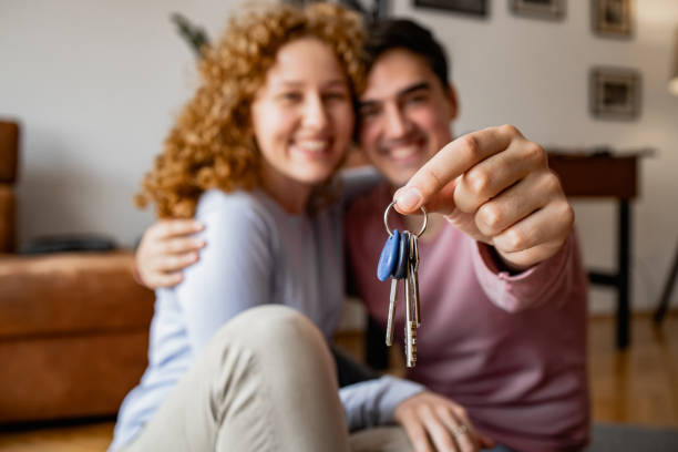 istock Happy couple in new home 1361407010