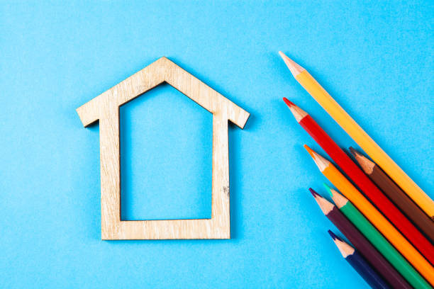 istock house and colored pencils on a blue background 1361408053