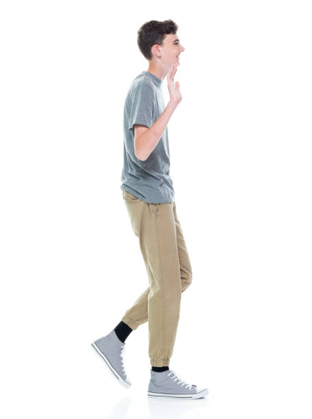 istock Caucasian boys walking in front of white background 1361409488