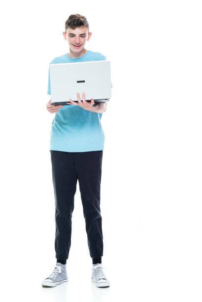 istock Caucasian male in front of white background and using computer 1361409655