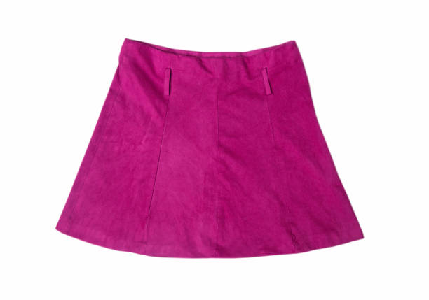 A beautiful young female in a black top and a purple skirt posing in a park