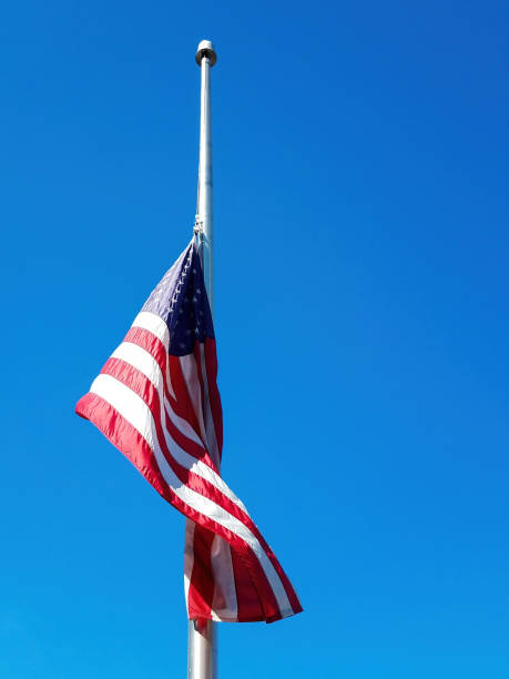 istock American Flag Flying At Half Mast 1361411670