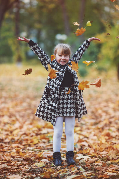 istock Girl autumn walk 1361411851