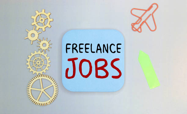istock Notebook with Tools and Notes with text on blue sticker FREELANCE JOBS. 1361413914
