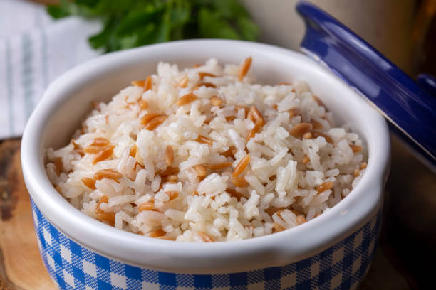 Traditional delicious Turkish food; Turkish style rice pilaf (Turkish name; Arpa sehriyeli pirinc pilavi) Traditional delicious Turkish food; Turkish style rice pilaf (Turkish name; Arpa sehriyeli pirinc pilavi) ARPA stock pictures, royalty-free photos & images