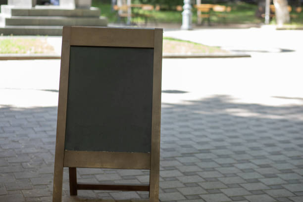 istock wooden table for outdoor cafe menu 1361419166
