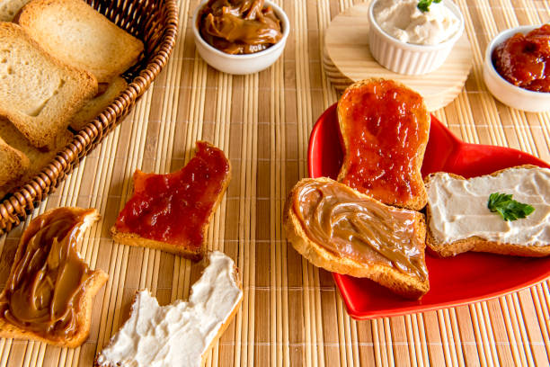 istock Toasted bread with jam, dulce de leche and ricotta cream on a breakfast table. 1361419310