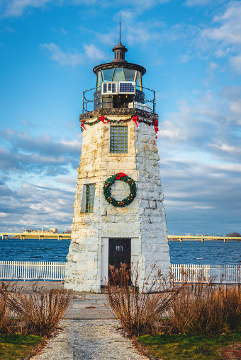 Goat Island Light dressed up for Christmas with a wreath and lights.
