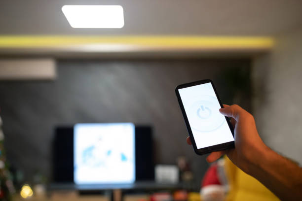 istock Controlling smart home with the phone 1361423787