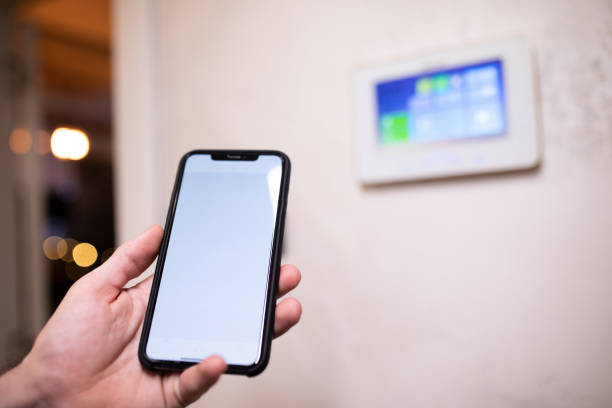 istock Controlling smart home devices via smart phone 1361424031