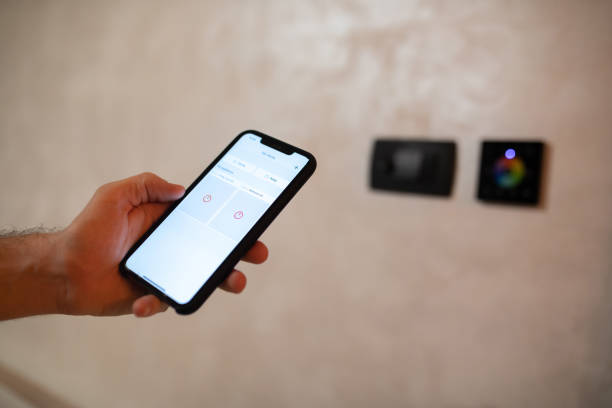 istock Adjusting home interior lights via smart phone 1361424093