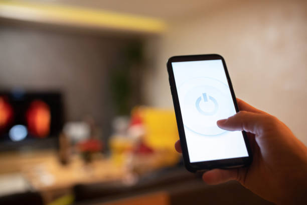 istock Controlling smart home with the phone 1361424125