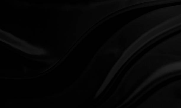 istock Black gray satin dark fabric texture luxurious shiny that is abstract silk cloth background with patterns soft waves blur beautiful. 1361427544