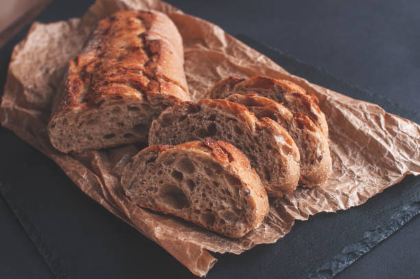 istock cereal baguette cut into pieces on parchment paper 1361428775