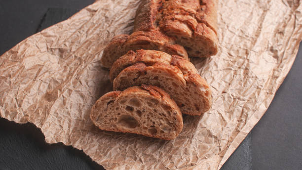 istock cereal baguette cut into pieces on parchment paper 1361428779