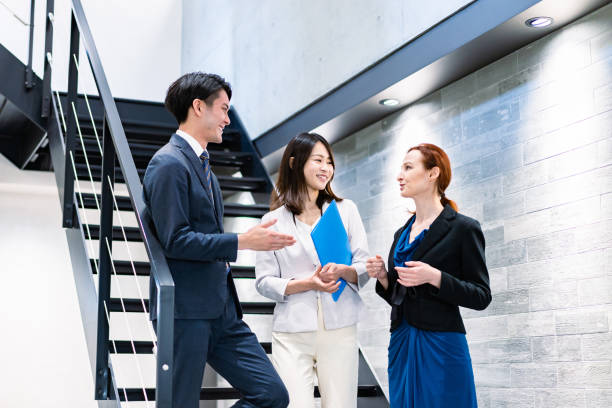 istock Business person talking on office stairs 1361429267