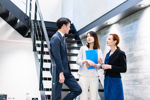 istock Business person talking on office stairs 1361429271
