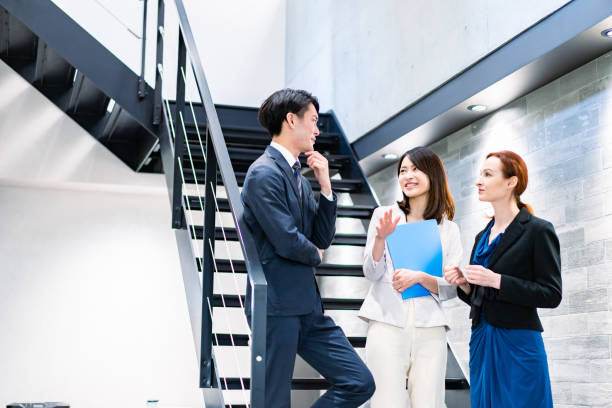 istock Business person talking on office stairs 1361429274
