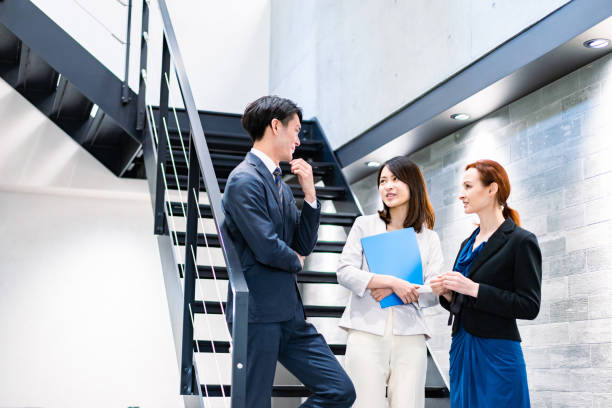 istock Business person talking on office stairs 1361429278