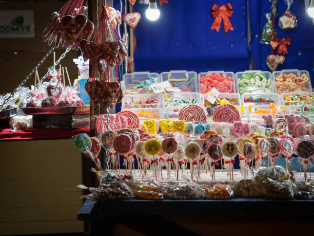 Selective blur on a stand of Belgrade christmas market selling Candies, candy sticks, sweets and lollilpops, diversified, display in loose. stock photo