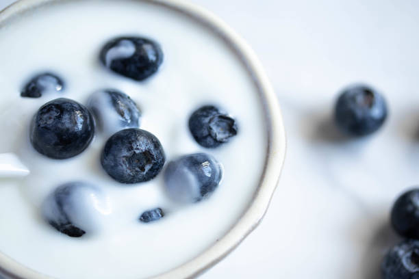 istock fresh blueberry yogurt in white cup on marble background 1361443657
