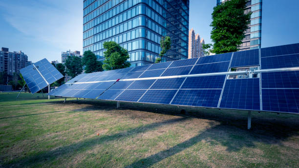 Outdoor solar panels and urban buildings Urban buildings and solar panels in Wuxi, China wuxi photos stock pictures, royalty-free photos & images
