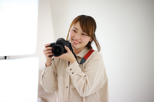 Smile female cameraman