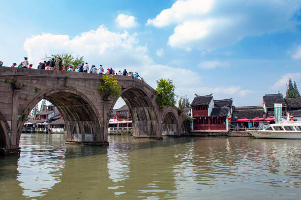 Fangsheng Bridge over the Dianpu River in Zhujiajiao Ancient Water Town, a historic village and famous tourist destination in Shanghai, China Shanghai, China - September 2019: Fangsheng Bridge over the Dianpu River in Zhujiajiao Ancient Water Town, a historic village and famous tourist destination in Shanghai, China Zhujiajiao stock pictures, royalty-free photos & images