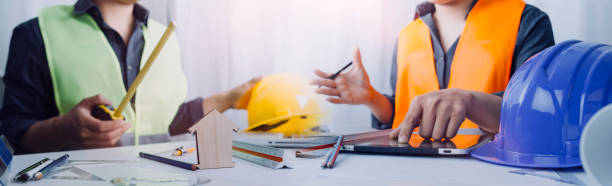 istock Architect or engineer working in office with blueprints,engineer inspection in workplace for architectural plan,sketching a construction project 1361451574