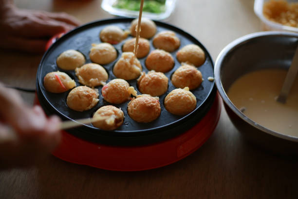 istock A couple making takoyaki at home 1361454721