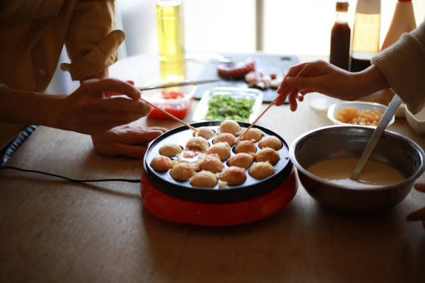 istock A couple making takoyaki at home 1361454727