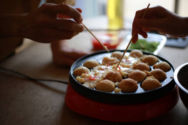 istock A couple making takoyaki at home 1361454729