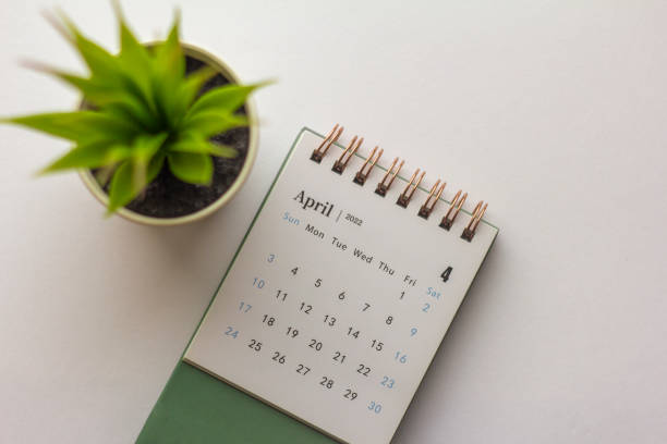 istock Desktop calendar for April 2022 on a light background. 1361454839