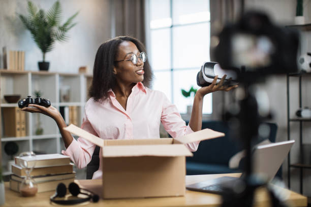 istock African blogger recording video while opening box 1361456981
