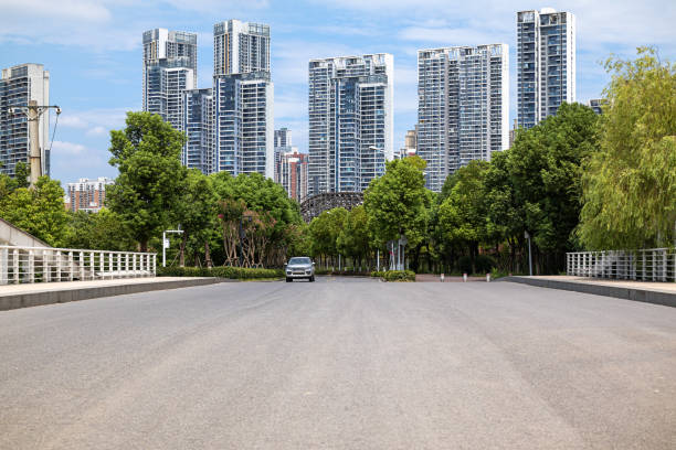 istock City road through modern buildings 1361458523