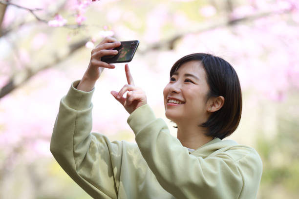 istock Female taking pictures with a smartphone 1361458865