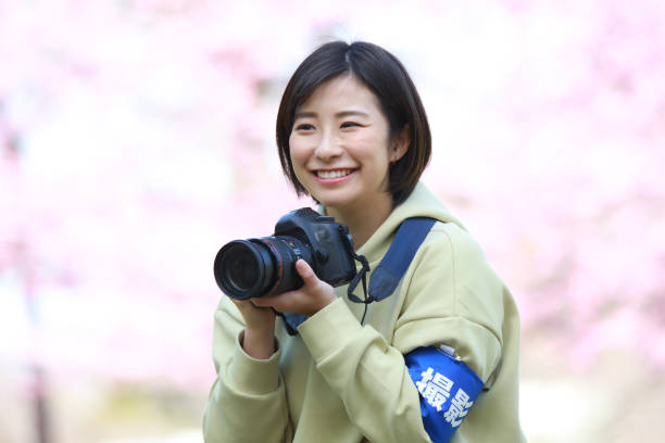 istock Female cameraman image 1361458981