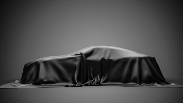 istock presentation car under black cloth on gray background. 3d rendering 1361459790