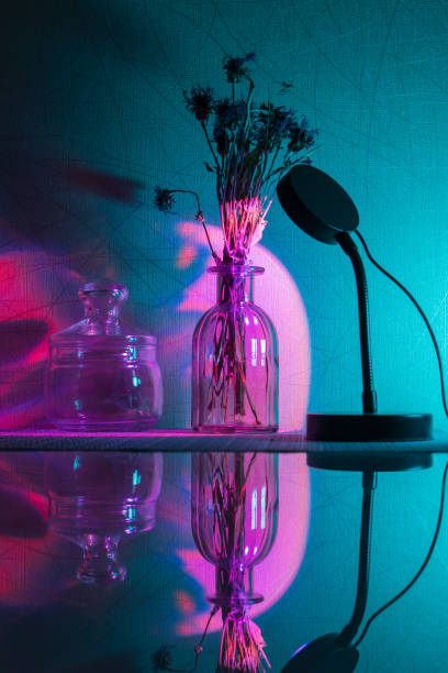 istock Sunset projector lamp on the table. Multi colored RGB light. Home decor. Vertical photo 1361462141