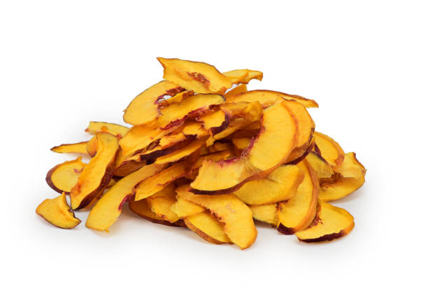 istock Slice of dried nectarine wedges with light shadow underneath isolated on a white background 1361468199