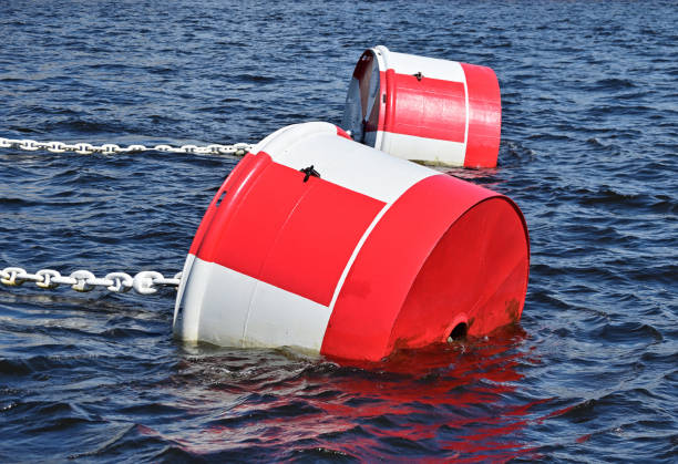 istock White and red mooring buoys with taut chains 1361468451