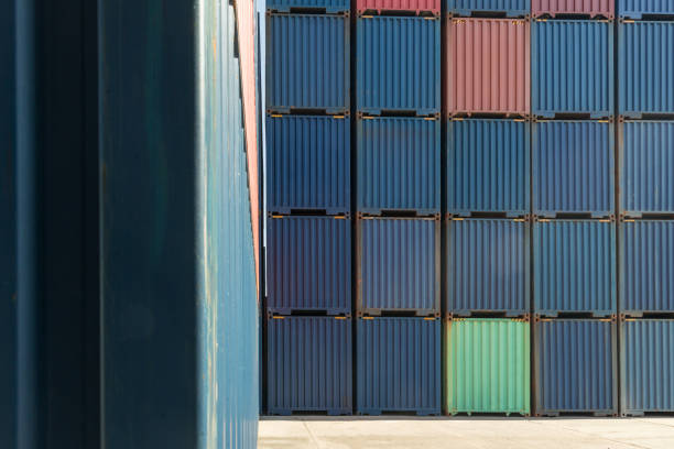Stack of containers in a harbor. Shipping containers stacked on cargo ship. Background of Stack of Containers at a Port.