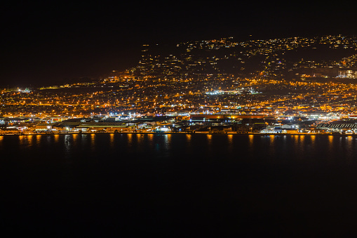 This July 2020 long-exposure image shows the Otago Harbour waterfront of Ōtepoti Dunedin, Aotearoa New Zealand. This image was photographed from the Signal Hill Lookout.