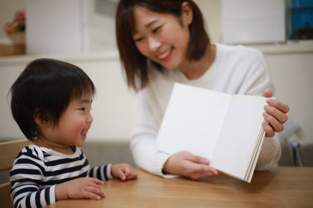 istock Parents and children reading 1361473513